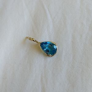 14 karat gold with blue topaz pendant
